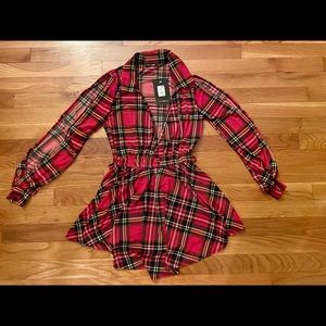 Never worn romper with price tag still on.